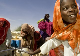 Fetching water at a refugee camp