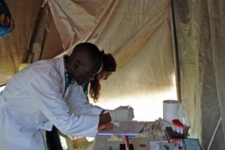 Carrying out HIV tests in a tent in Gulu, Uganda Carrying out HIV tests in a tent in Gulu, Uganda