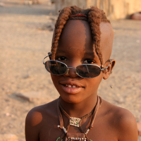 Himba girl, by Yves Picq http://veton.picq.fr (Own work) [GFDL (http://www.gnu.org/copyleft/fdl.html) or CC-BY-SA-3.0-2.5-2.0-1.0 (http://creativecommons.org/licenses/by-sa/3.0)], via Wikimedia Commons
