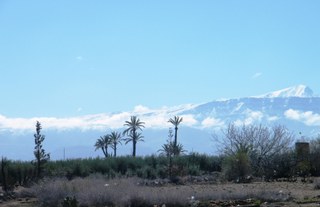 Moroccan mountains loom in the distance