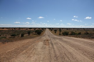 A long road cutting through the Kalahari desert