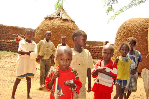 Children in front of granaries, Niger