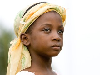 A youngster wearing traditional clothing A youngster wearing traditional clothing