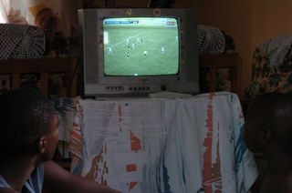 Boys watching football on TV