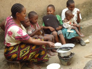 A woman providing food for her children