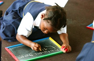 A child drawing on a blackboard