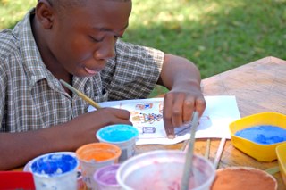 A child painting, Zimbabwe A child painting, Zimbabwe