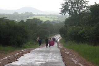 Children walking down a rural road